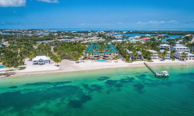 Marathon Villa | PA Beach, Pool, kitchen, Dock, Ocean View, BBQ, arrive any day, tropical, patios