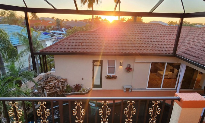Punta Gorda House | Paradise Palace King bed