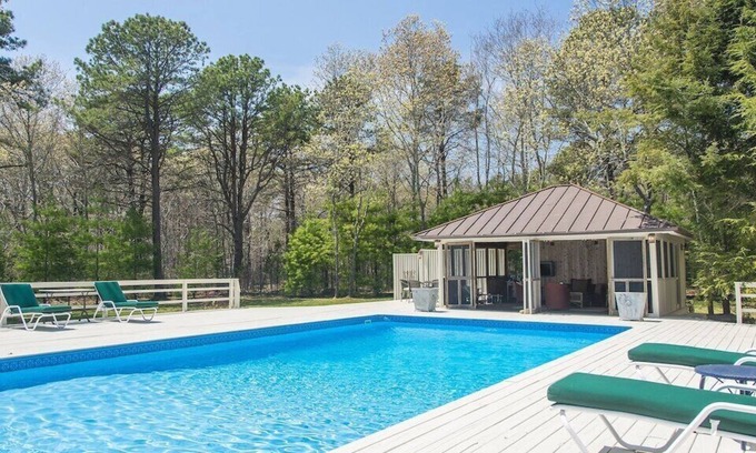 Wainscott Woods House | Private Hamptons vacation home, set on an acre of land, entertainer’s...