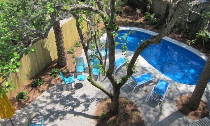 Tybee Island Cottage | Private Pool + Whimsical Sleeping Porch Steps from Beach by Tybee Cottages