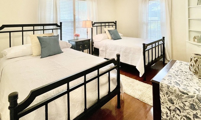 Midtown Cottage | Quaint cottage style home with two sitting areas-2 minutes to shops and eateries