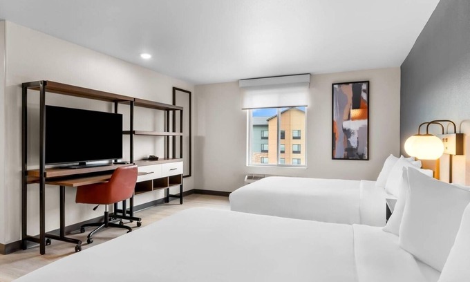 Cheyenne Hotel | Relax in a Comfortable Suite w/Fully Equipped Kitchen & Dedicated Workspace
