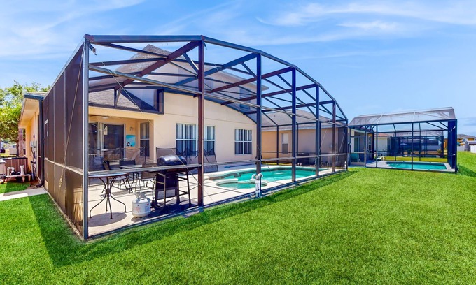 Crystal Cove House | Relaxing Florida getaway with an enclosed pool, grill, game room, & central AC