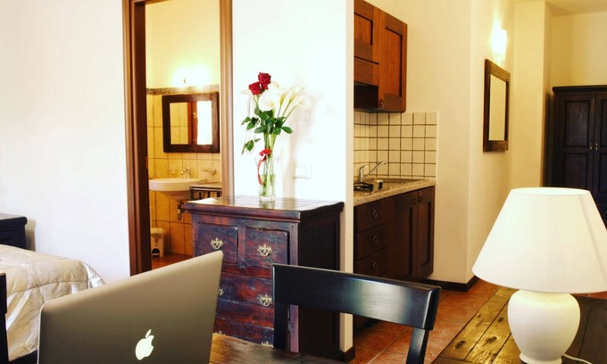 Teulada Apartment | Residenza Locci Aparthotel & Rooms Studio Apartment with Terrace in the greenery in the center of Teulada.
