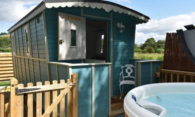 Llanfair Caereinion Cottage | River View 13 is a four berth large glamping cabin.