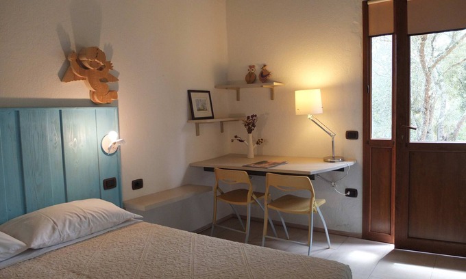 Aglientu Apartment | Room 'Angelo' with Shared Pool, Private Terrace and Air Conditioning
