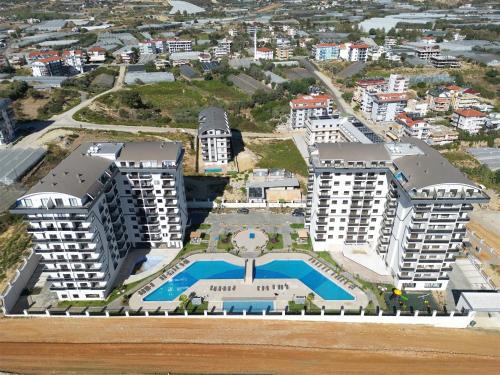 Payallar Apartment | Sıfır Muhteşem Havuzlu Aileye Özel 1e1 Rezidans