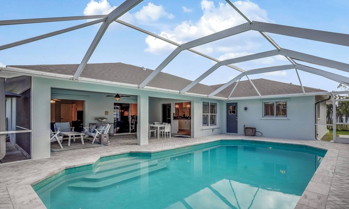 Burnt Store House | SEASIDE COTTAGE - Southern fenced yard, tropical fruit trees, pool, contemporary