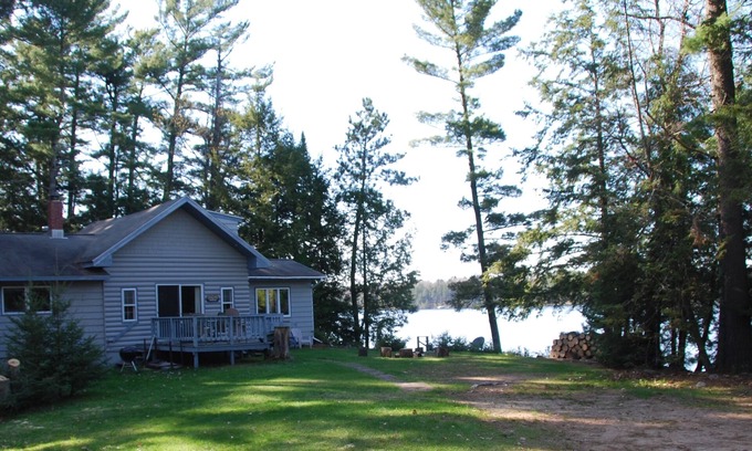 Eagle River House | Secluded 2 acre Lakefront Home with boat and motor included on 5 lake chain.