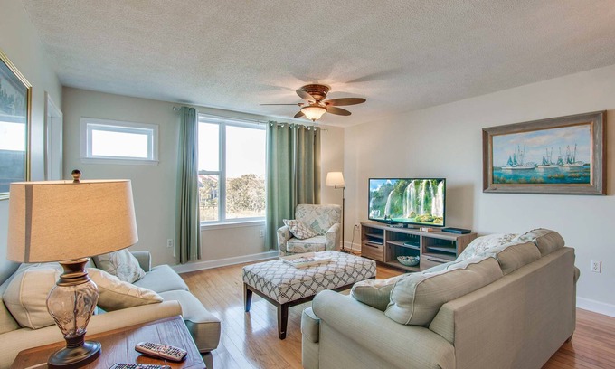 Folly Beach Villa | Second-floor condo with river views and access to a community pool