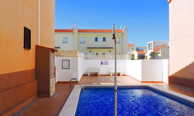 Miami Platja Cottage | Semi-detached house with community pool in Miami Playa 400 meters from the sea