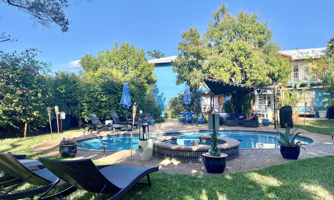 South Palm Park Neighborhood Association Apartment | Short Walk to Beach/Town-Artistic Apt., Gorgeous Garden W/Beautiful Shared Pool