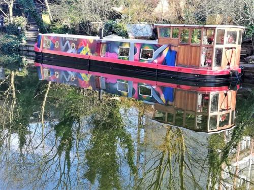 Angel Boat Rental | Slash Arts houseboat on secluded mooring in central London