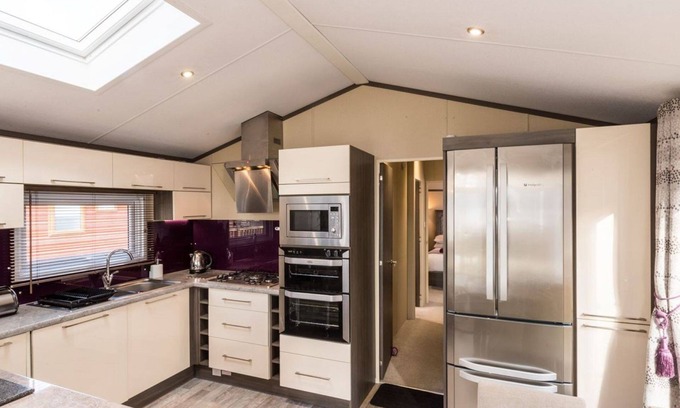 Windermere Cabin | Sleeps 4 plus a tiny tot. Fabulous lake views with spacious outside terrace and hot tub