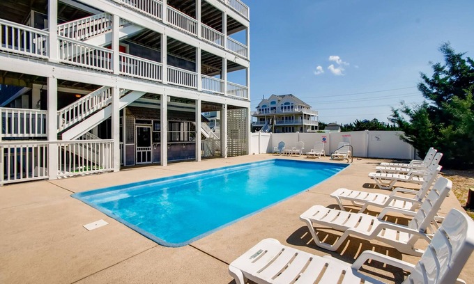 Wind Over Waves House | Soundside Home w/Pool, Hot Tub, Elevator, Game Room, Tiki Bar, and Much More!