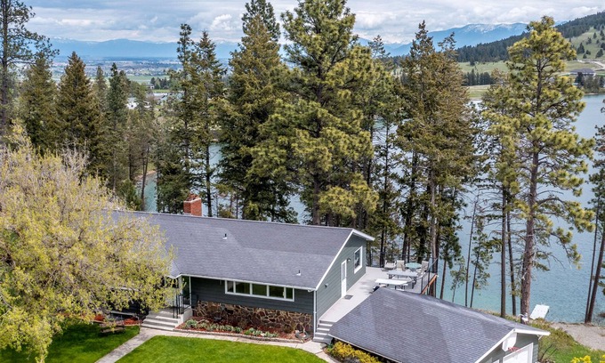Kalispell House | Spacious lakefront home with private hot tub, kayaks, canoes & dock