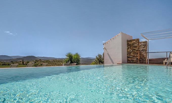 Prado del Rey House | Spend the vacation in this inviting cottage with magnificent mountain panorama.
