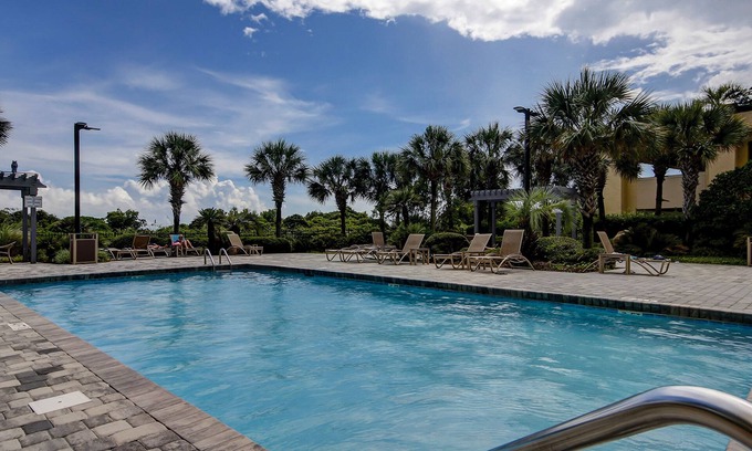 Arcadian Shores Condo | Sprawling oceanfront condo with balcony, pool, hot tub, & beach access