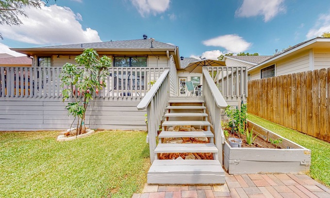College Station House | Sunny stay between Houston and Austin with pond views, deck, & modern interior