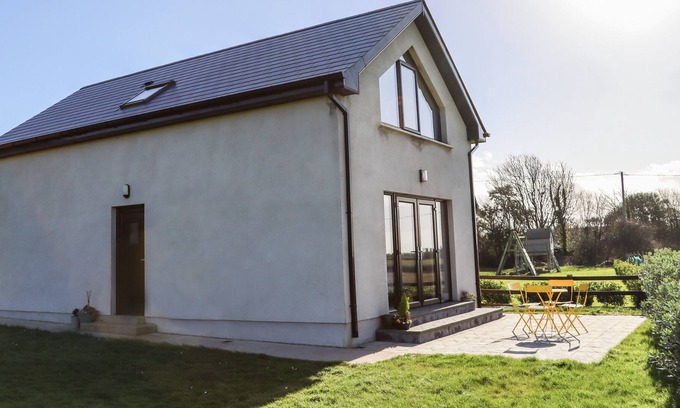 Fethard on Sea Cabin | SUNSET VIEW LODGE, pet friendly in Fethard-On-Sea, County Wexford