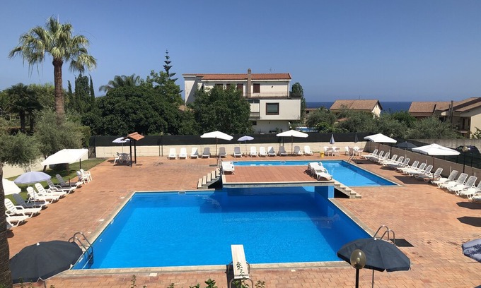 Capo Mulini Apartment | The pool terrace - Baia di Capomulini