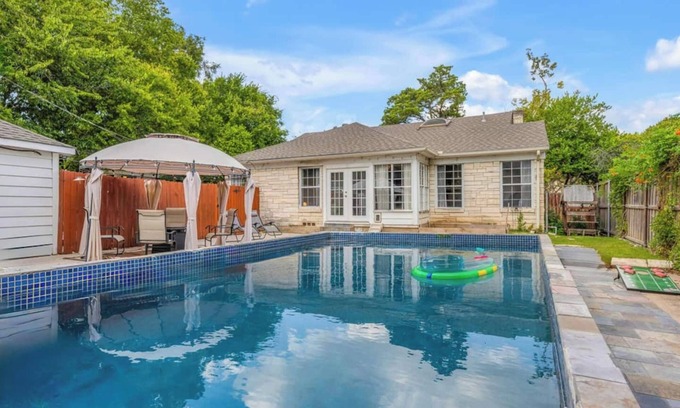 Oak Cliff House | The private home features two master suites with King beds and full attached bathrooms. The loft is 3rd private getaway with a Queen bed and attached full bath. Fully stocked kitchen and a separate Oak dining area.