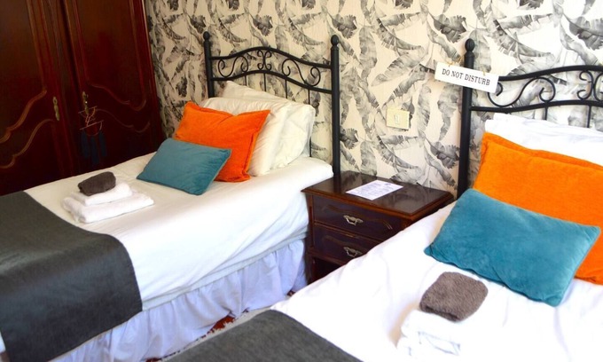Vilaflor Apartment | This room has two single beds with an en-suite bathroom. The room has views of the village square.