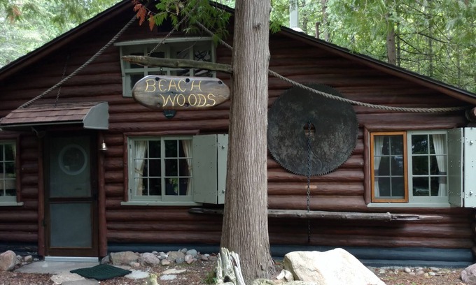 Charlevoix Cottage | Unique log cottage with view of Lake Michigan-pet friendly!