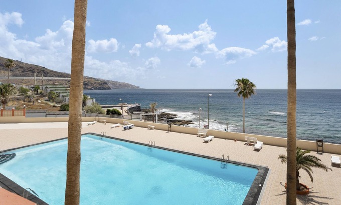 Las Caletillas Apartment | Vacation Apartment 'Arenitas Sunset 1' with Sea View, Shared Pool and Wi-Fi