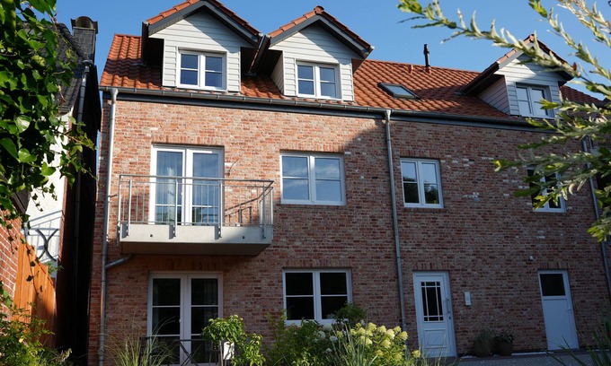 Toenning Apartment | Vacation apartment "Norderhus" (WH2) with 70sqm - quiet central location - with balcony