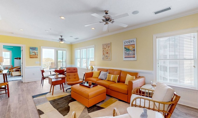 Hatteras Condo | Vibrant beach retreat with washer/dryer, central AC, deck, & pool access