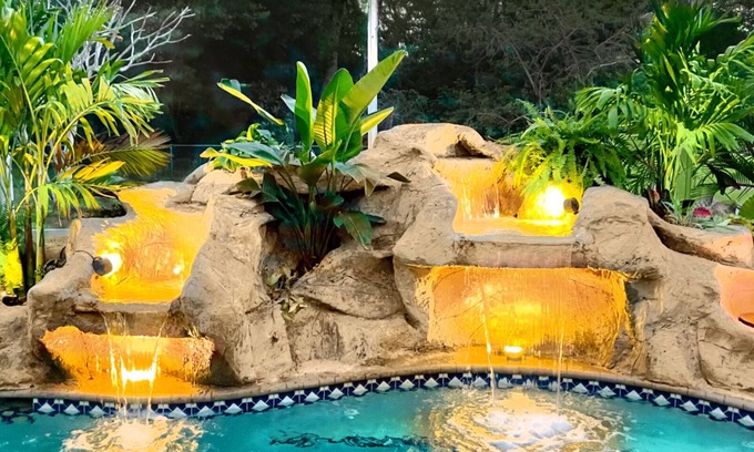 Pelican House | Waterfall saltwater Lagoon heated pool, 2 King Suites, Sauna!
