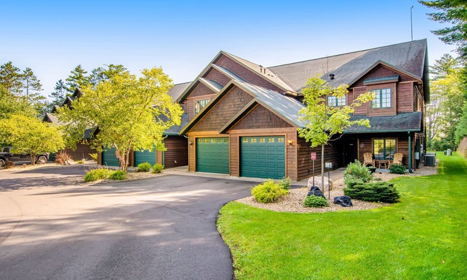Eagle River House | Waterfront condo with lake views, boat slip, grill, beach, AC, fireplace, & WiFi