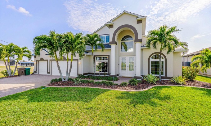 Burnt Store House | Waterfront dog-friendly house with pool, dock, pool spa, patio & sunrise views