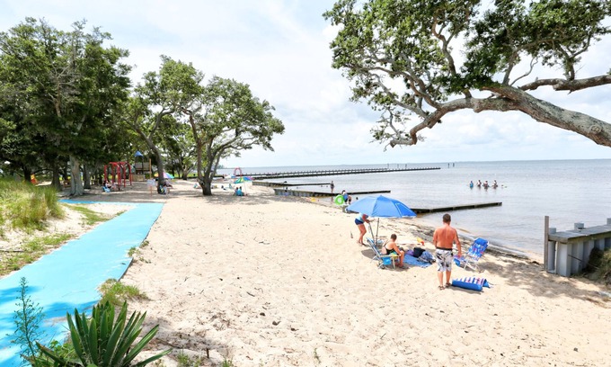 Colington Harbour House | Waterfront home with deck, balcony, outdoor shower, water views, AC