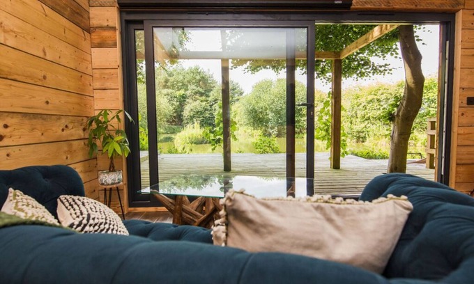 Burythorpe Cabin | Woodland cabin with private lake, sauna + fire pit