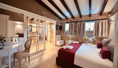 Habitación cama extragrande con bañera exenta 