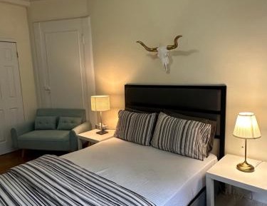 Queen Room with Shared Bathroom