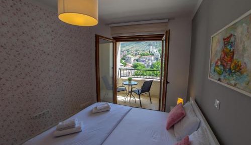 Two-Bedroom Apartment with Balcony and City View 