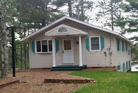 Waterboro House | Perch on Lake Sherburne Sleeps FOUR. Waterfront Lake House with Dock Makes a Great Home Base for Daily Excursions