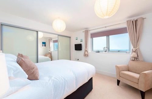 Lusty Glaze Apartment | 2 Bolowthas Court-Spacious apartment close to beaches, parking, coastal and sea views.