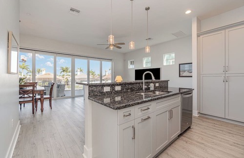 Cape Harbour Condo | 2 Story Lux Waterfront Living in Cape Harbour- Pool & Dock