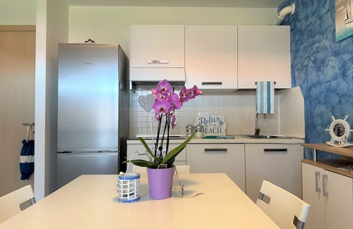 Aprilia Marittima Apartment | Flat in a colourful residence with pool