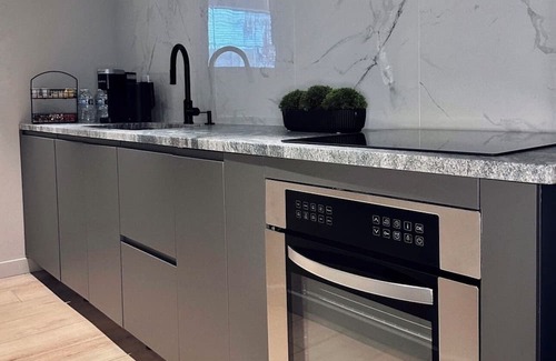East Allegheny Apartment | KING BED Private Patio & Parking Central Stay