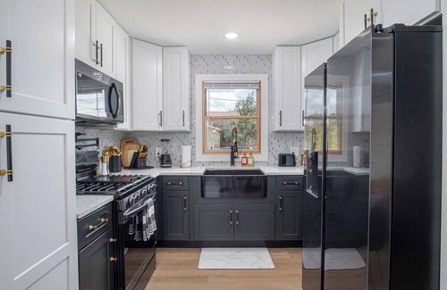 Eastside Promise Neighborhood House | Stylish Stay with Unforgettable Downtown Views!