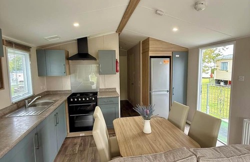 Cross Inn House | Welcoming family caravan on large pitch near beautiful New Quay in West Wales