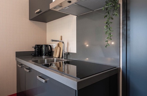 Centrum Apartment | Artist-inspired suite for 2 with king bed, private kitchen, air conditioning, and all modern comforts. Perfect for couples or solo travelers.