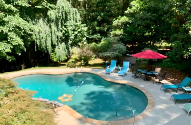 Private acreage with in-ground pool, sunroom, & two kitchens - dog-friendly