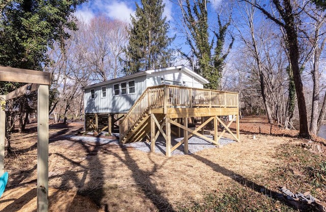 Riverfront with 2 homes featuring 7 bedrooms Outdoor Pavilion 2 Hot Tubs Fire Pit and Pool