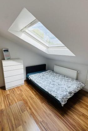 Charming Attic Retreat with Sloped Roof
